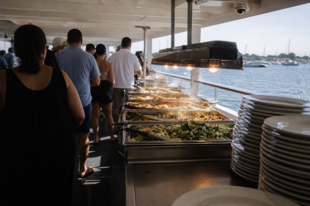 Spirit of Boston dinner cruise buffet station with harbor view