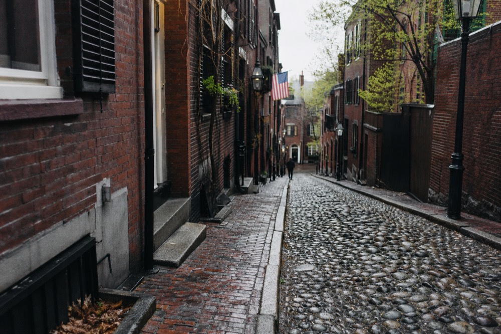 Acorn Street in Beacon Hill, a narrow cobblestone lane with brick row houses