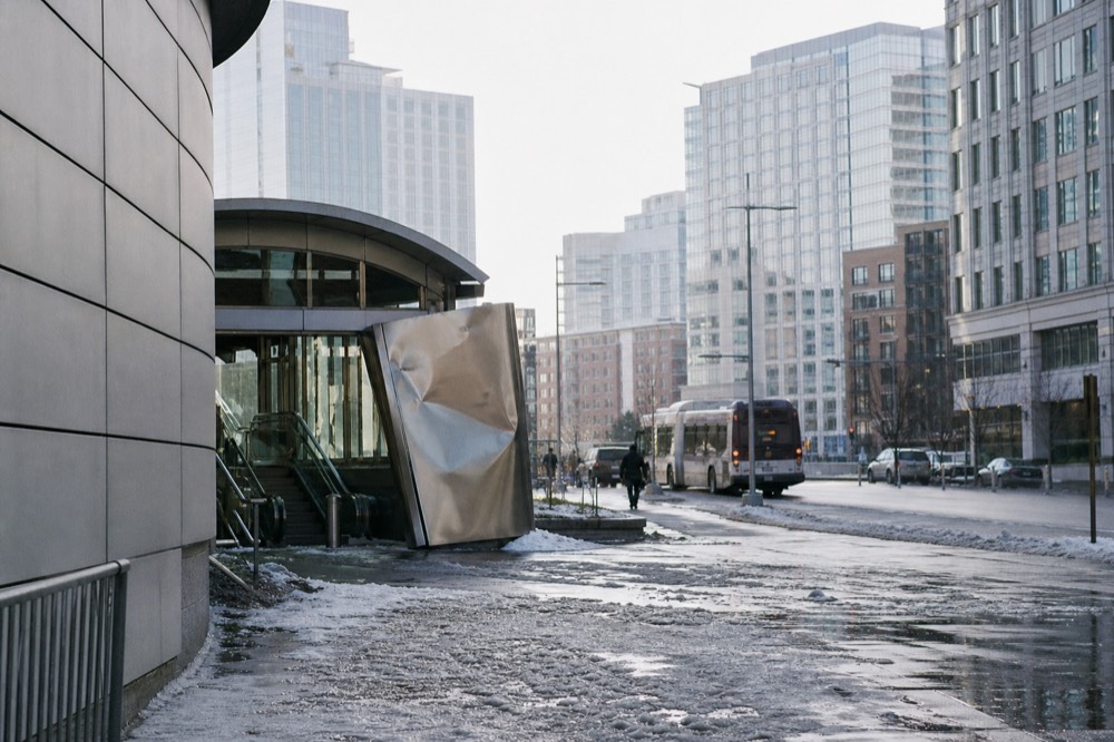 A quiet Boston street with the MBTA Silver Line bus station entrance in the Seaport district
